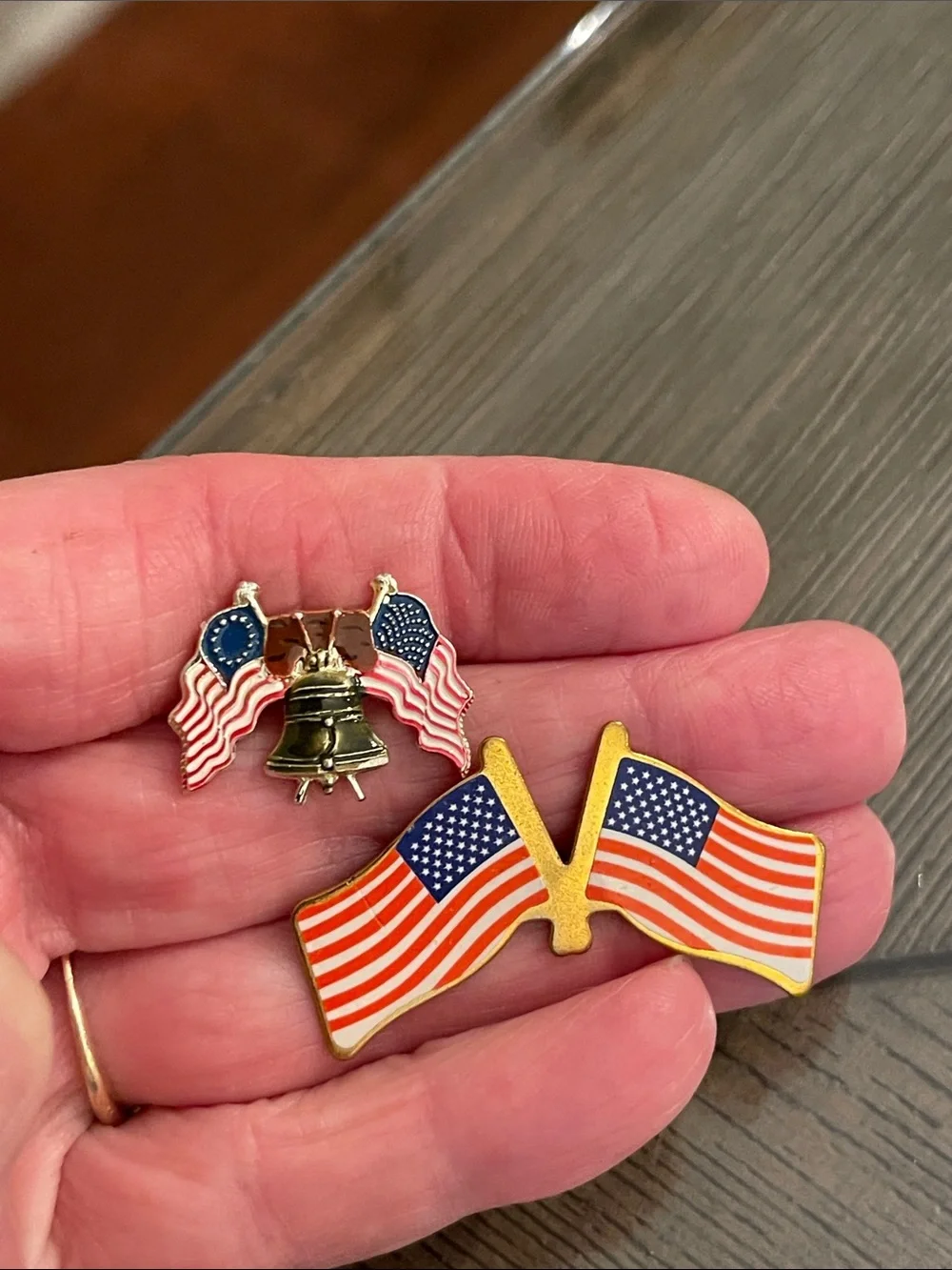 Patriotic Lapel Pin Features Liberty Bell Between Two Crossed American Flags